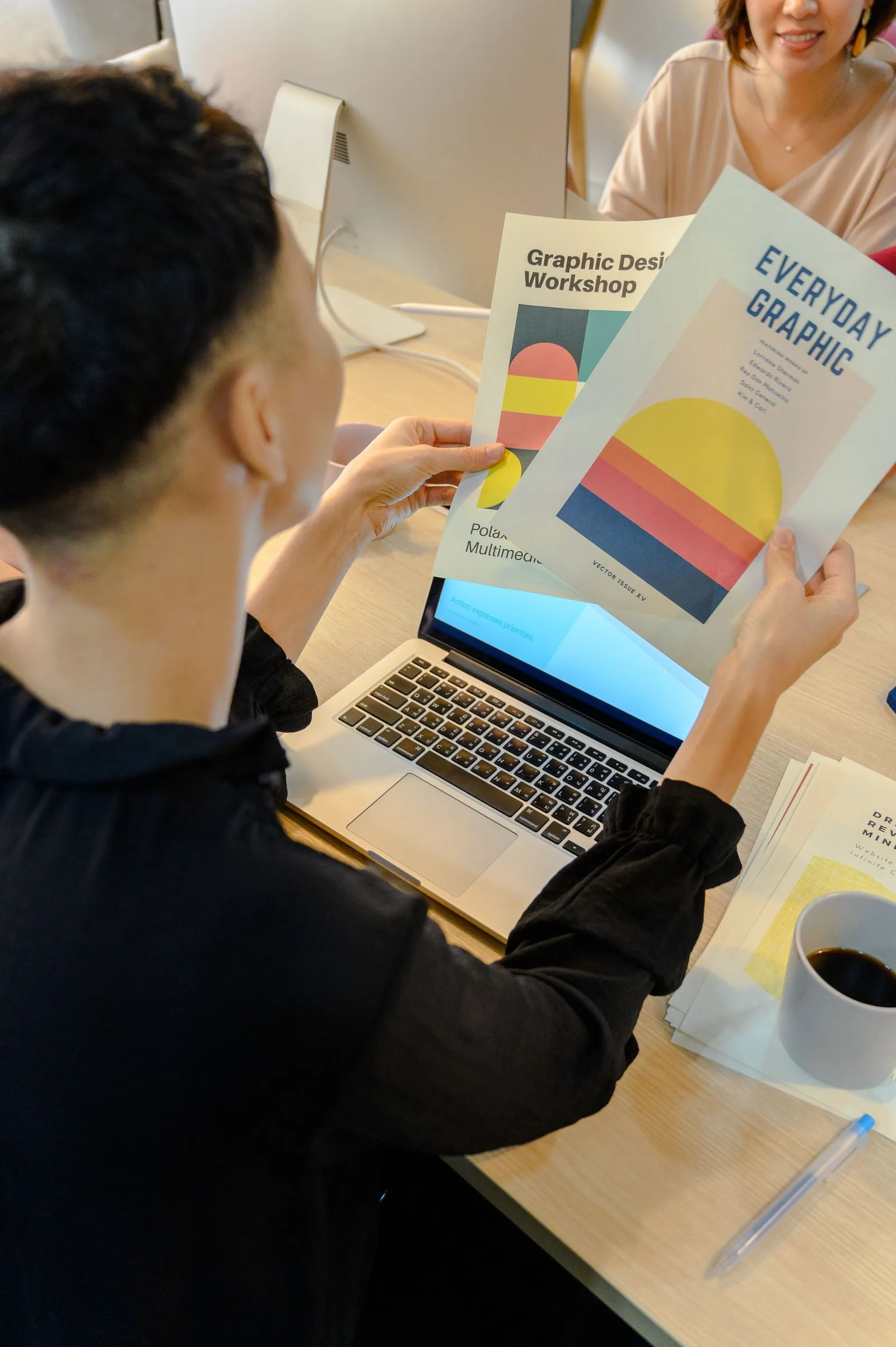 Designer preparing packaging artwork at a creative workspace