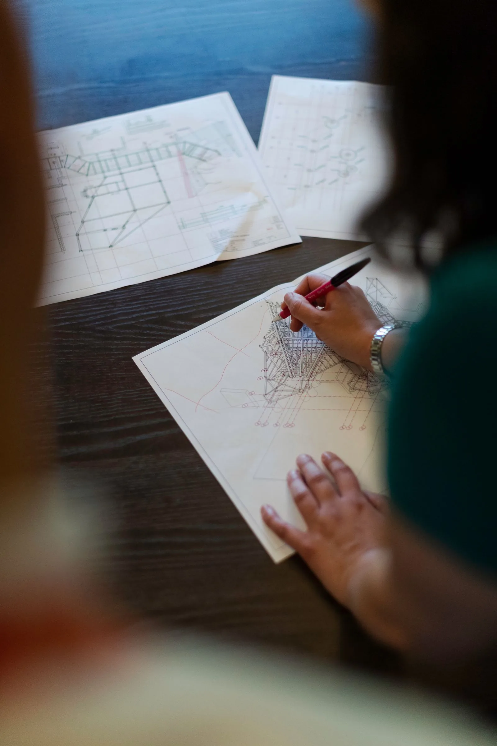 Engineer refining a product design sketch