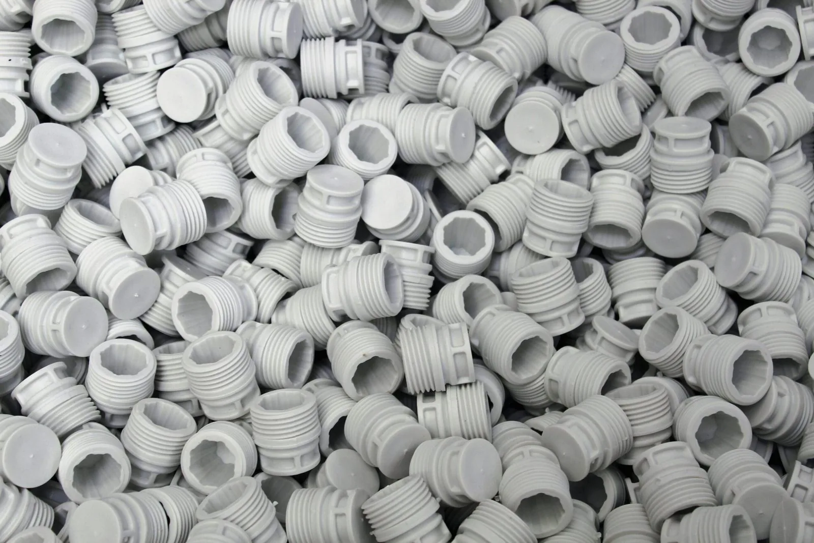 A batch of molded sample parts fresh from the tool