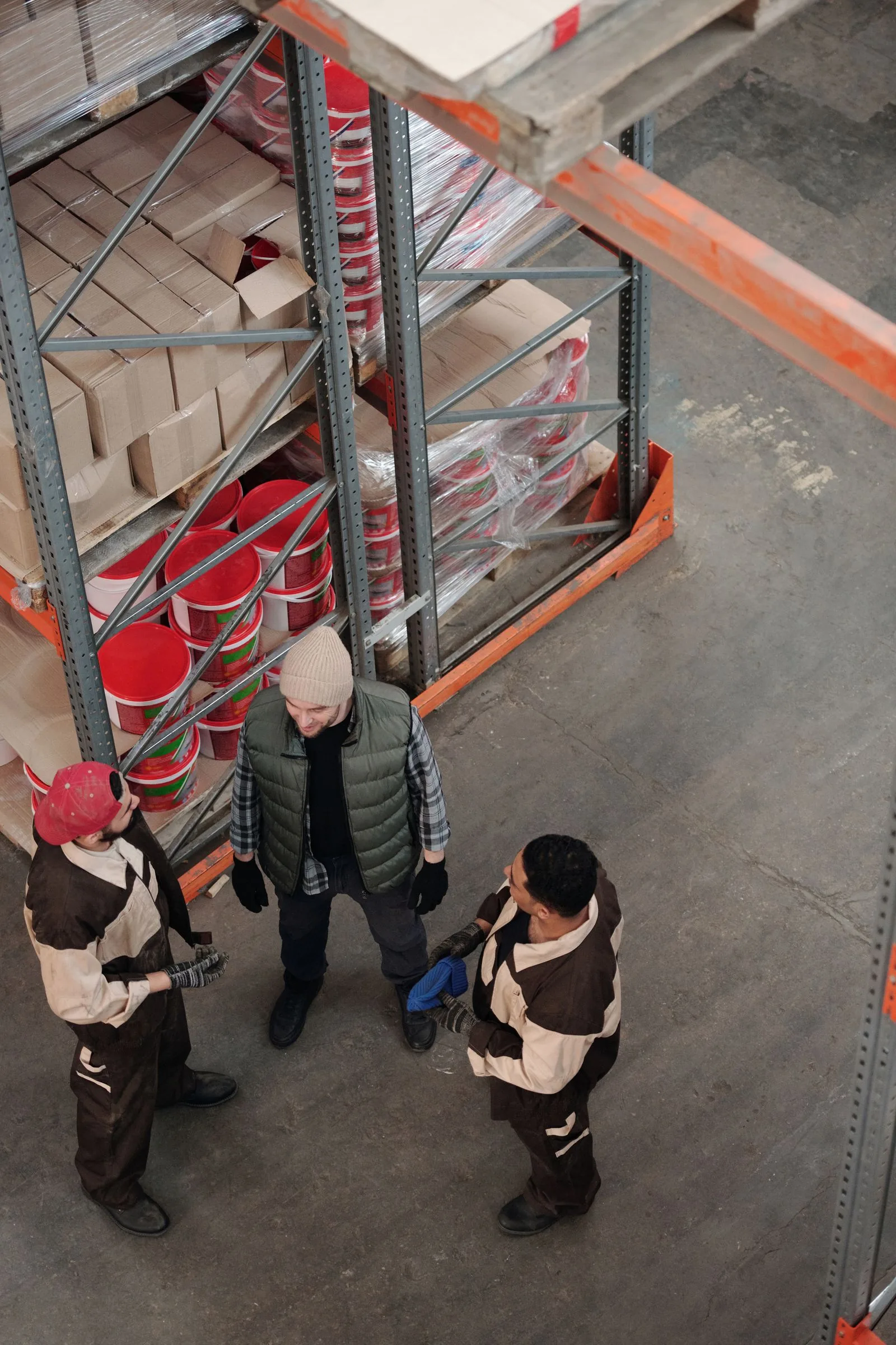 Team discussing supplier options inside a warehouse